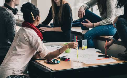 group of people collaborating to avoid burn out